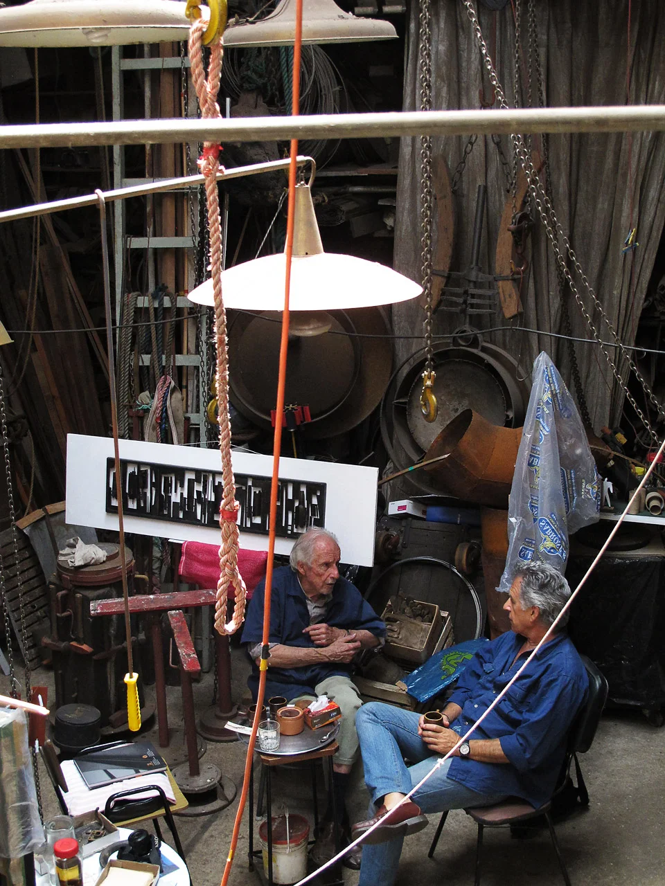 sculptor, montevideo, uruquai • octavio podestá in his atelier talking with photographer oscar bonilla