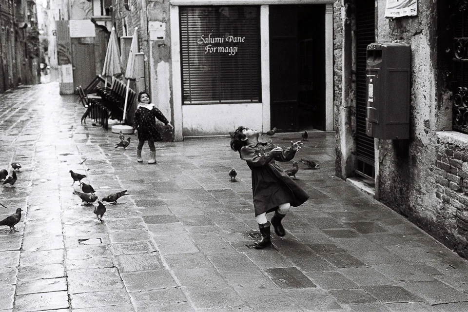 girls playing with doves , venice 1993