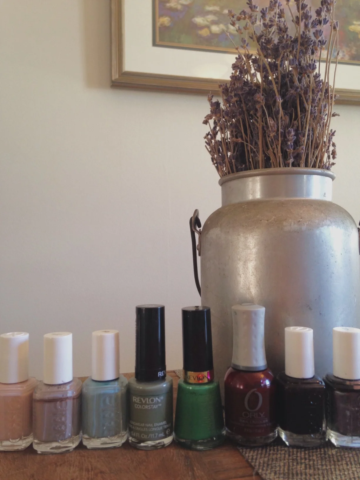 L to R: Essie- Topless & Barefoot, Essie- Miss Fancy Pants, Essie- Parka Perfect, Revlon Colorstay- Spanish Moss, Revlon- Posh, Orly- Ruby, Essie- Luxedo, Essie- For the Twill of it 