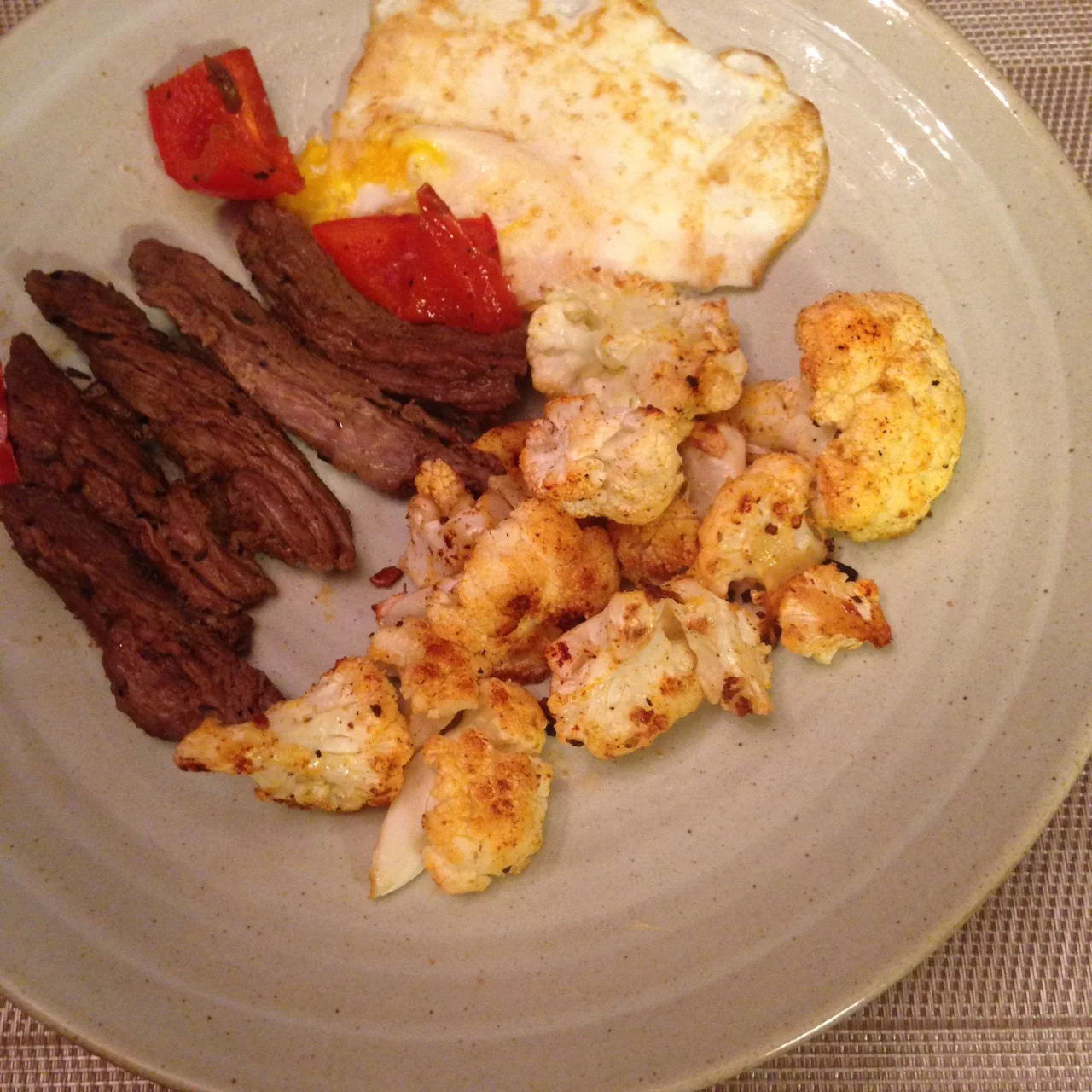 Dinner at home: skirt steak, eggs, grilled red peppers, roasted cauliflower 