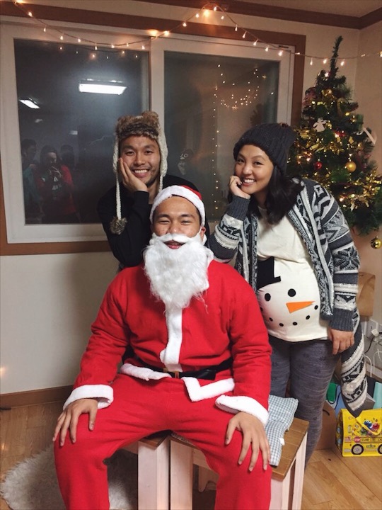 With Asian Santa! Just a side note: My husband takes the "ugly" part of the ugly sweater party very seriously, my faux fur vest (not shown) made it into his OOTN. 