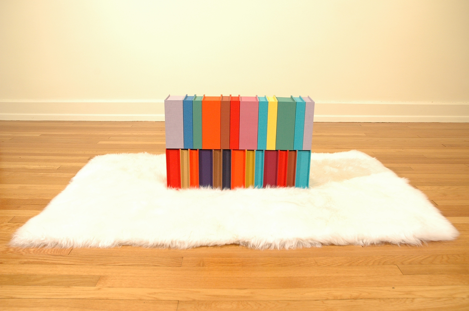 LbeOtrVayEal/AtrMahOosUinR; Bookdbinding Board, Fabric, Sheepskin Rug; 24" x 6" x 16"; 2005-06