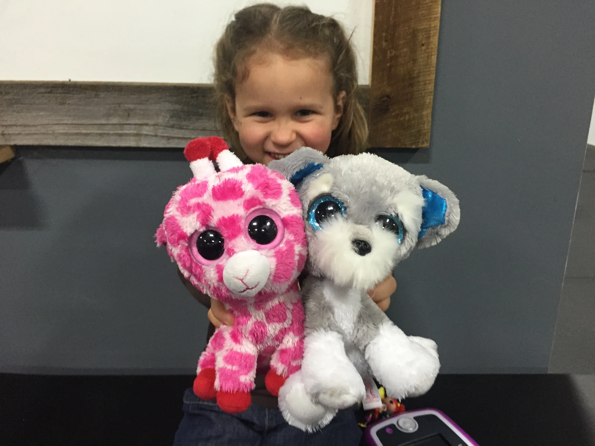You can't be angry with Tia about this workout because...look at Hannah and her cute stuffed animals! Doesn't that make you forget about rowing and burpee pull ups? So cute!