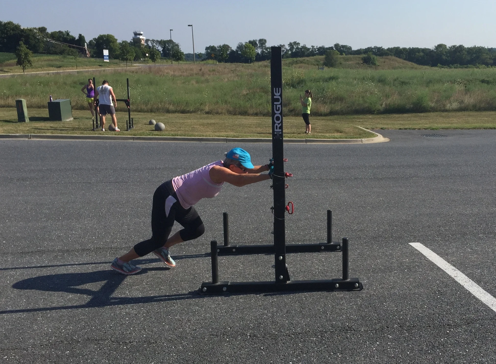Margaret, pushing the prowler during a Strongman workout.