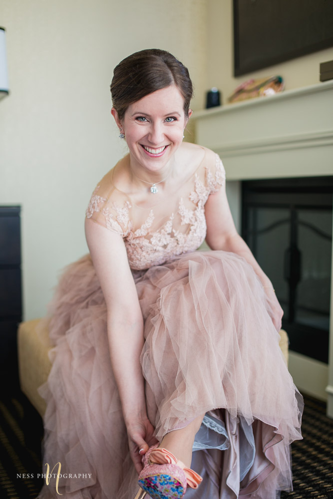 bride wearing blush dress and getting ready for elopement
