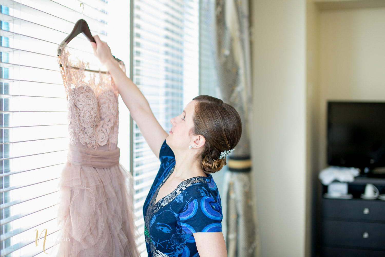 bride picking up her blush dress for montreal elopement