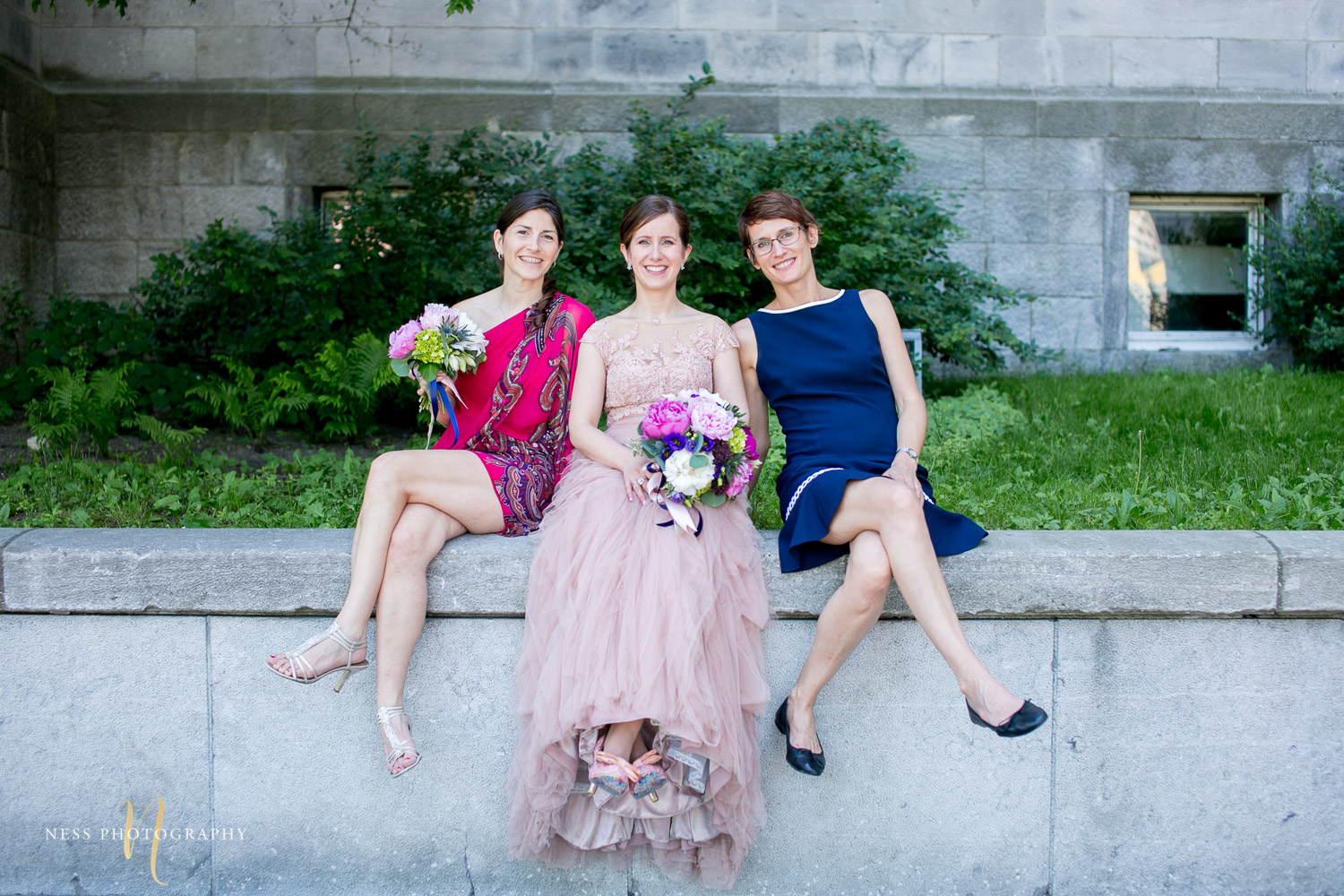 bridesmaids sitting during montreal elopement in old port