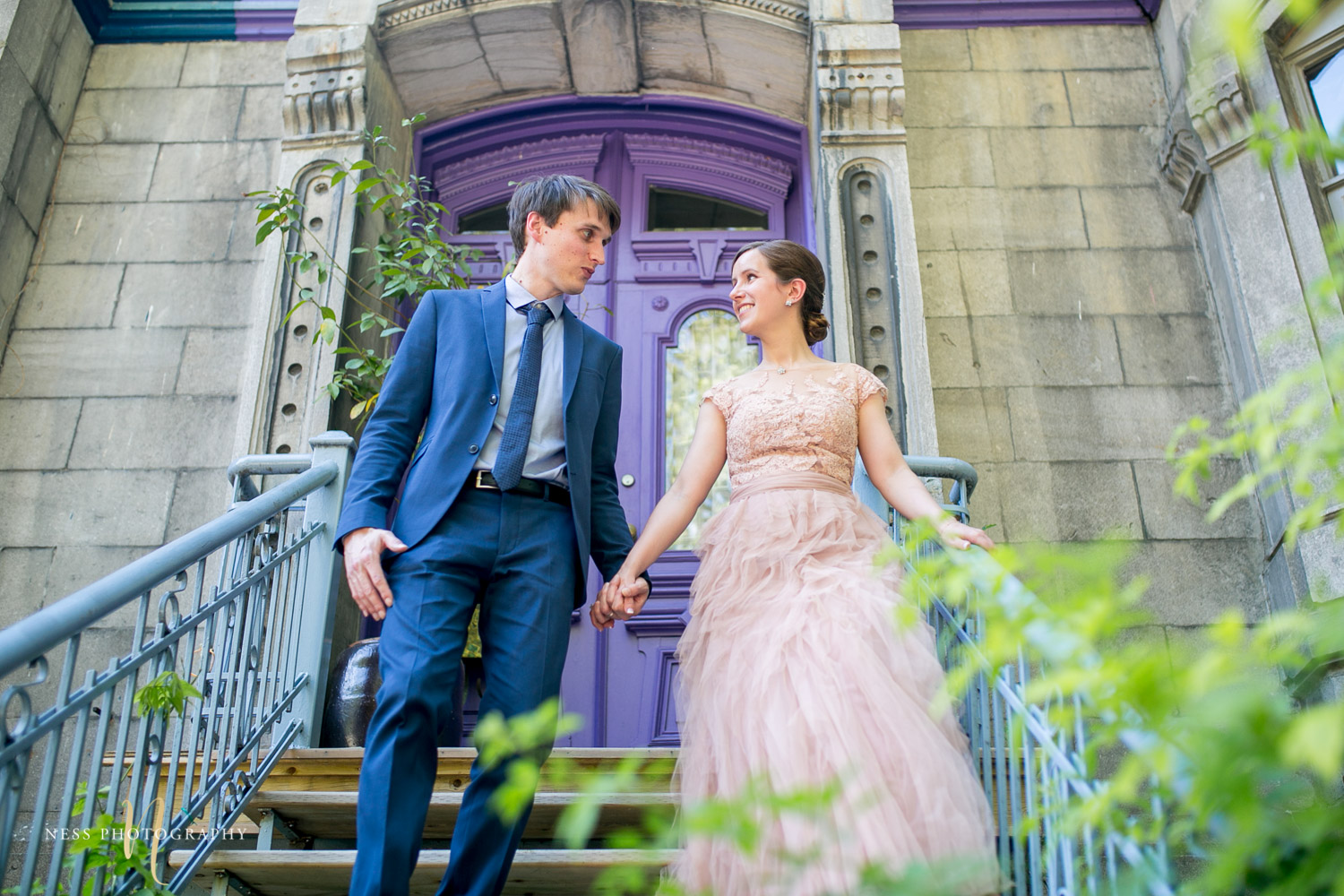 bride and groom on the stairs in plateau mont royal square saint louis