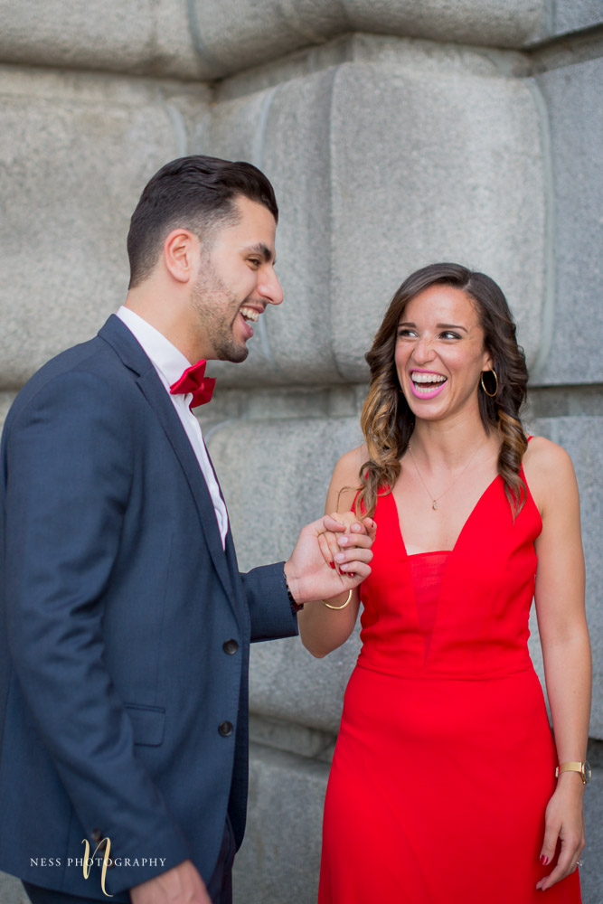 couple looking at each other and laughing during montreal engagement photoshoot at oratoire saint joseph
