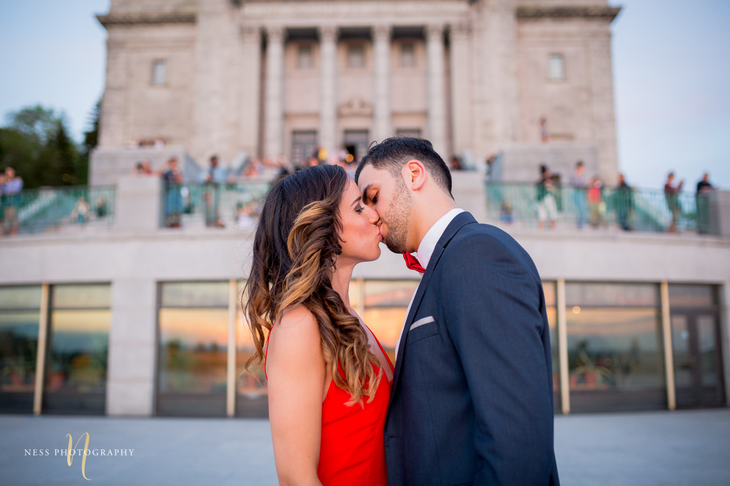 couple kissing during montreal engagement session at saint joseph oratory with montreal wedding photographer