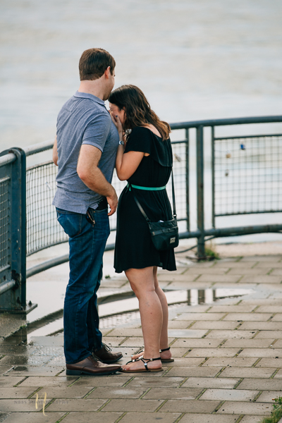 couple hugging and crying after surprise proposal in old montreal clock tower