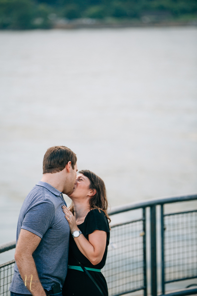 couple kissing after surprise proposal in old montreal