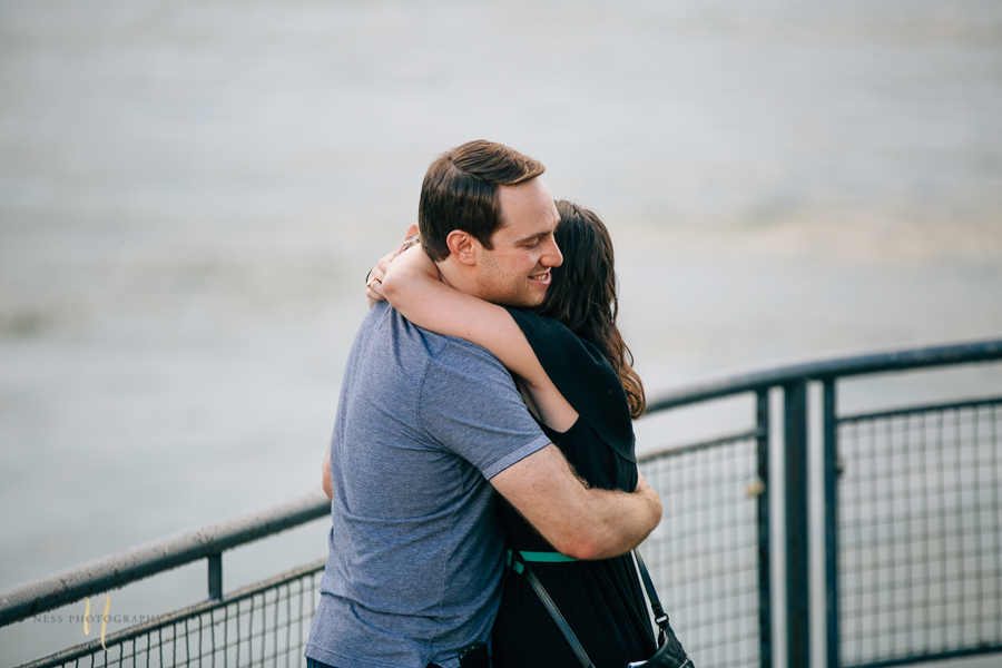 couple hugging after surprise proposal in old montreal