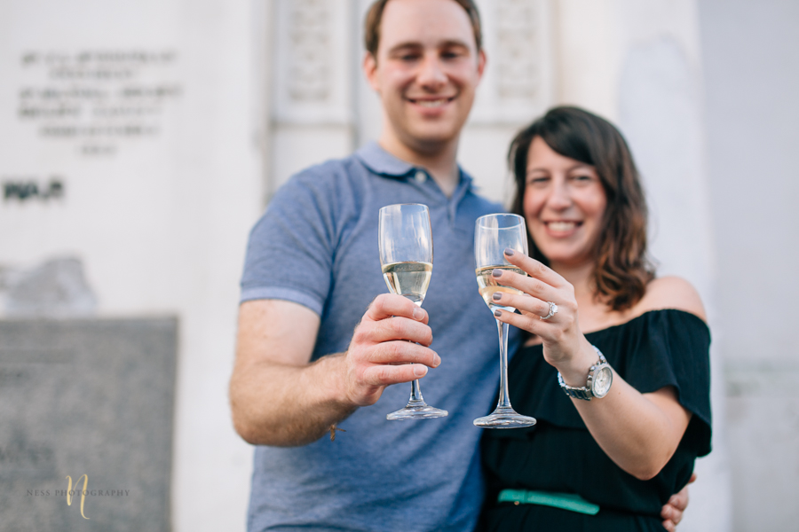 Surprise proposal  with champagne in montreal old port clock tower by ness photography montreal wedding photographer  3.jpg