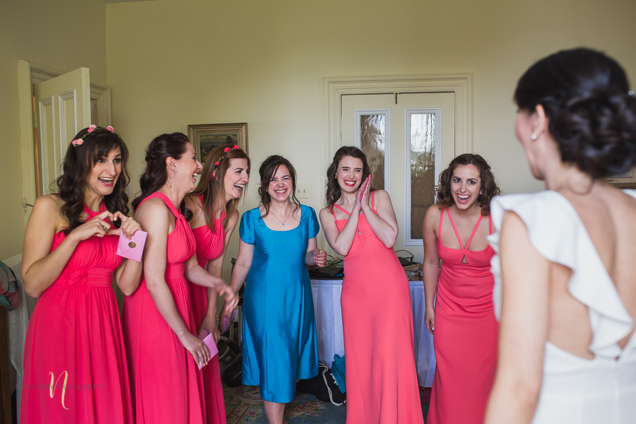 bridesmaids surprise when they see the bride during Wedding at Forest and Stream club by Ness Photography