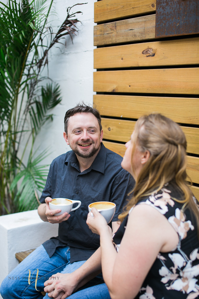 couple laughing at Foundation coffee co engagement photoshoot- Tampa Florida  wedding photographer 