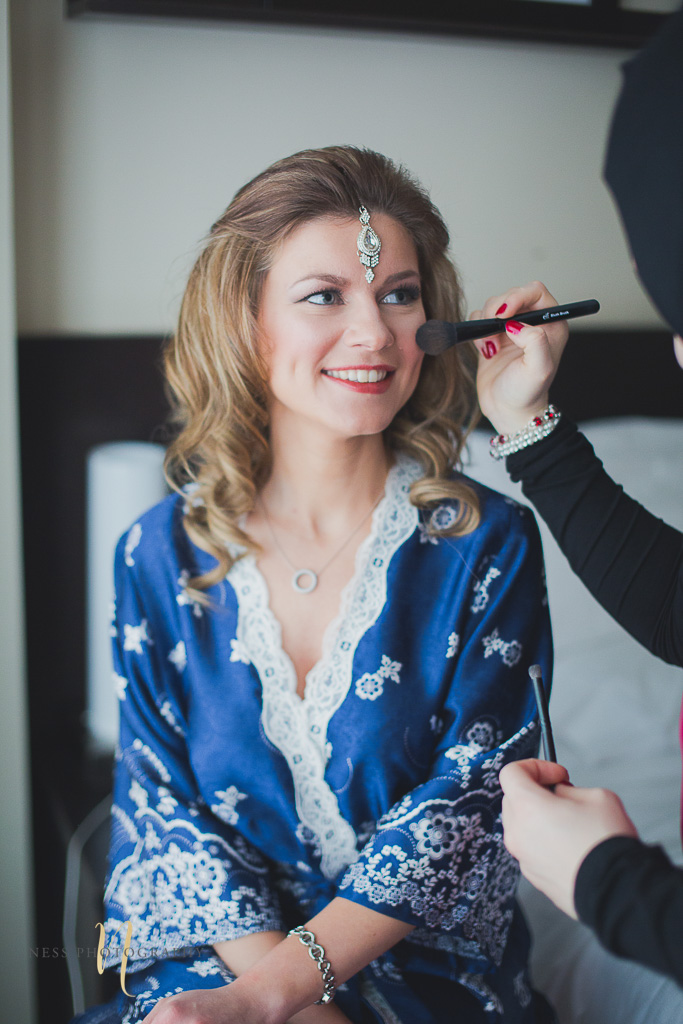 bride getting her makeup done at pakistani wedding in montreal old port