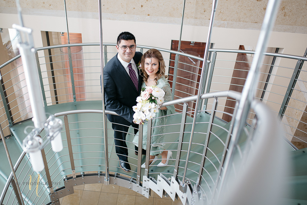 Bridal photos for pakistani wedding in Montreal old port-- bride and groom on the stairs