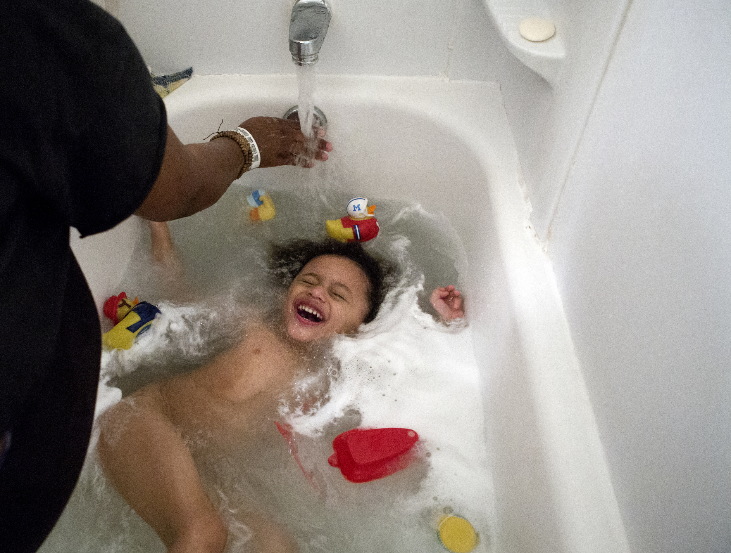 Nandi Hill, 22, and her son Mike, 3, prepares for bed on Tuesday, Dec. 23, 2014. "Single parenting is hard, the challenges started when I had to potty train my son and I had to teach him how to do it like a Man" Nandi stated. She tells her