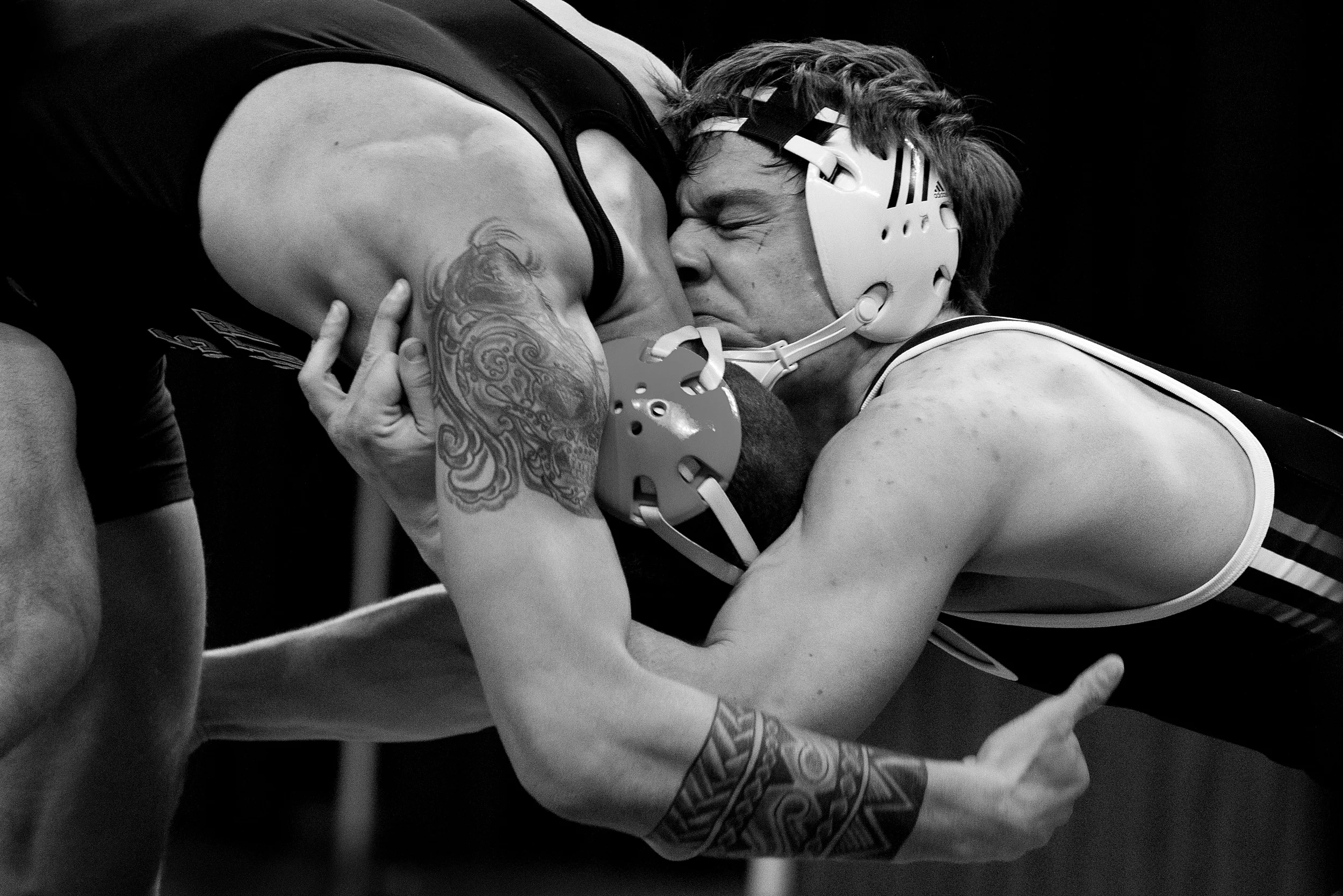  Connor McMahon, right, shoots a shot against Nick Kee during a wrestling match on Saturday, March 7, 2015.&nbsp;McMahon although ranked 5th in the conference tournament wins his match against Kee who was ranked 1st. He moves on to the final round and wins the tournament. 