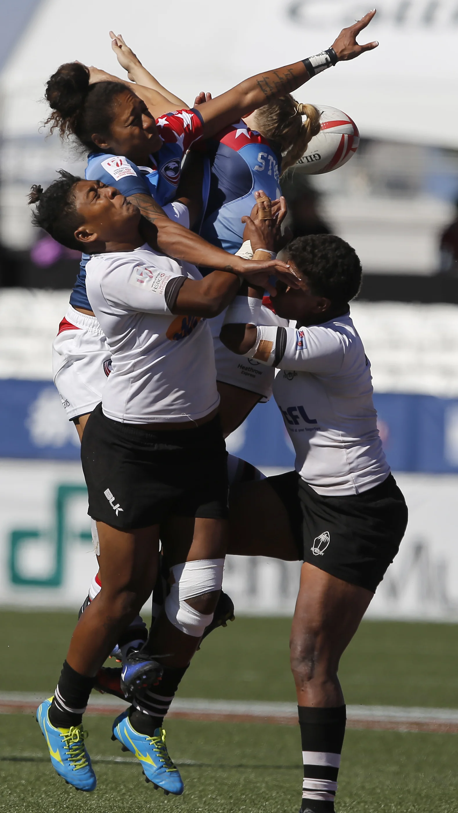  USA and Fiji athletes collide during a USA Sevens rugby match at the Sam Boyd Stadium on Friday, March 3, 2017, in Las Vegas. USA won 14-7. (Christian K. Lee/Las Vegas Review-Journal)&nbsp; 