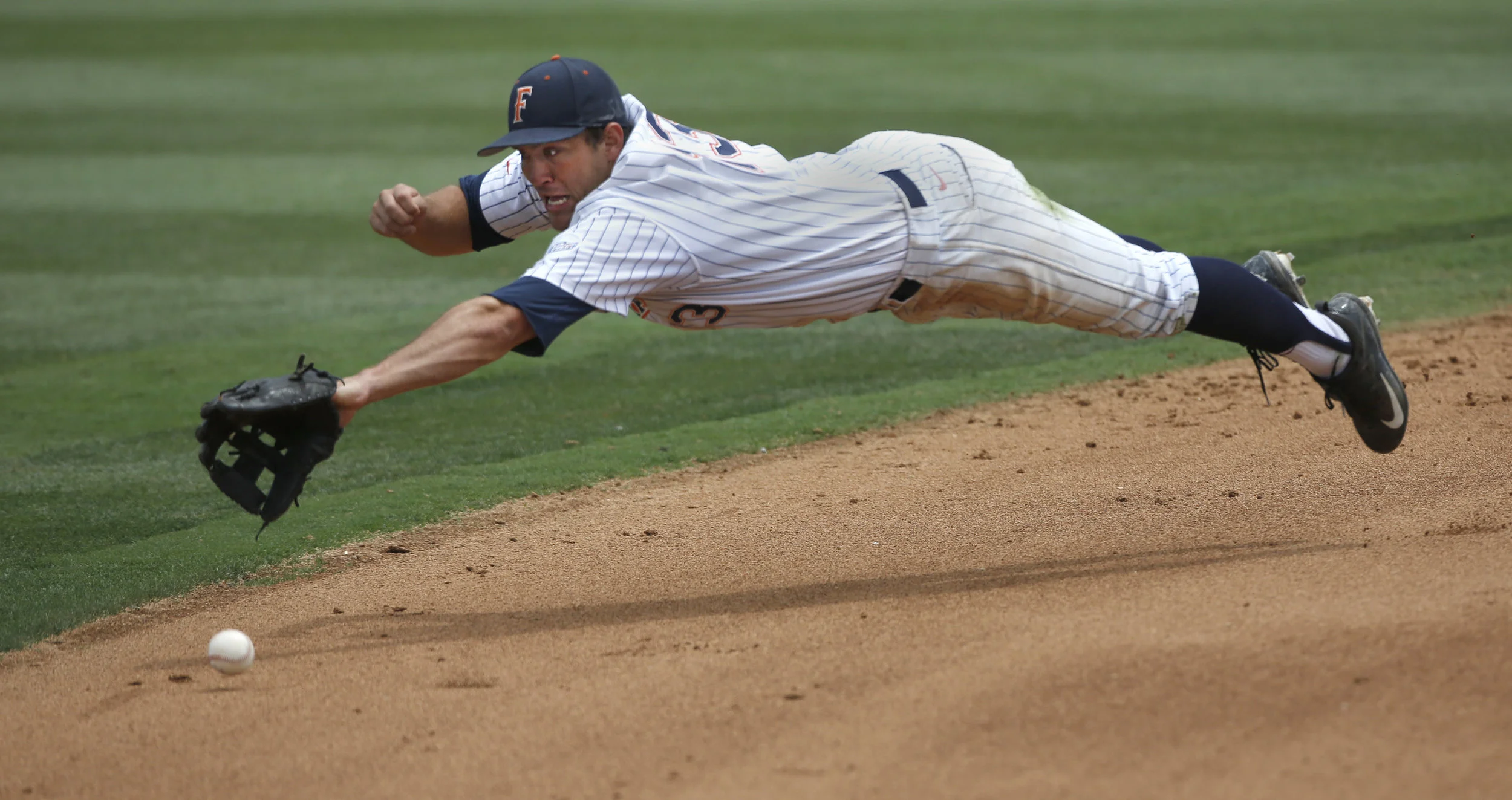  Cal State Fullerton's Timmy Richards (13) misses a catch during the fifth inning of a College World Series Super Regional NCAA baseball game at Blair Field in Long Beach, CA on Saturday, June 10, 2017. Cal State Fullerton won 12-0. (Christian K. Lee/ Los Angeles Times) 