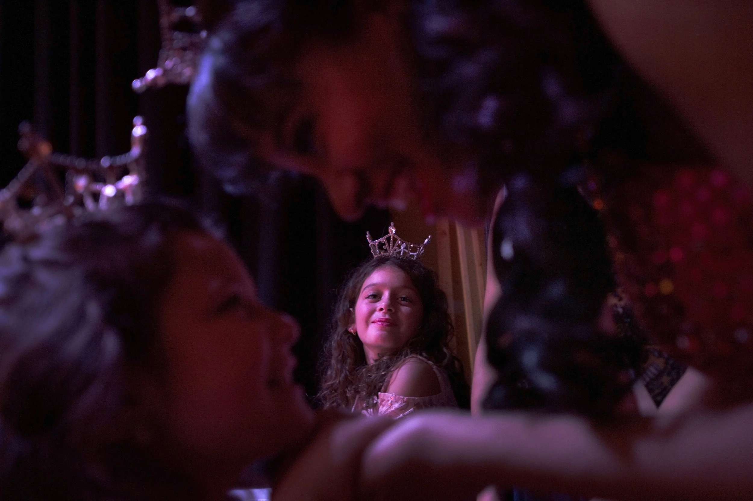  Giovanna Lettiere, 10, center, smiles at Francesca Brior, 7, left, and Shereen Pimental, 19, as they embrace during the Miss Adirondack Scholarship Pageant at Immaculate Heart Central on Saturday, Oct. &nbsp;7 2017 in Watertown. Pimental is the prev