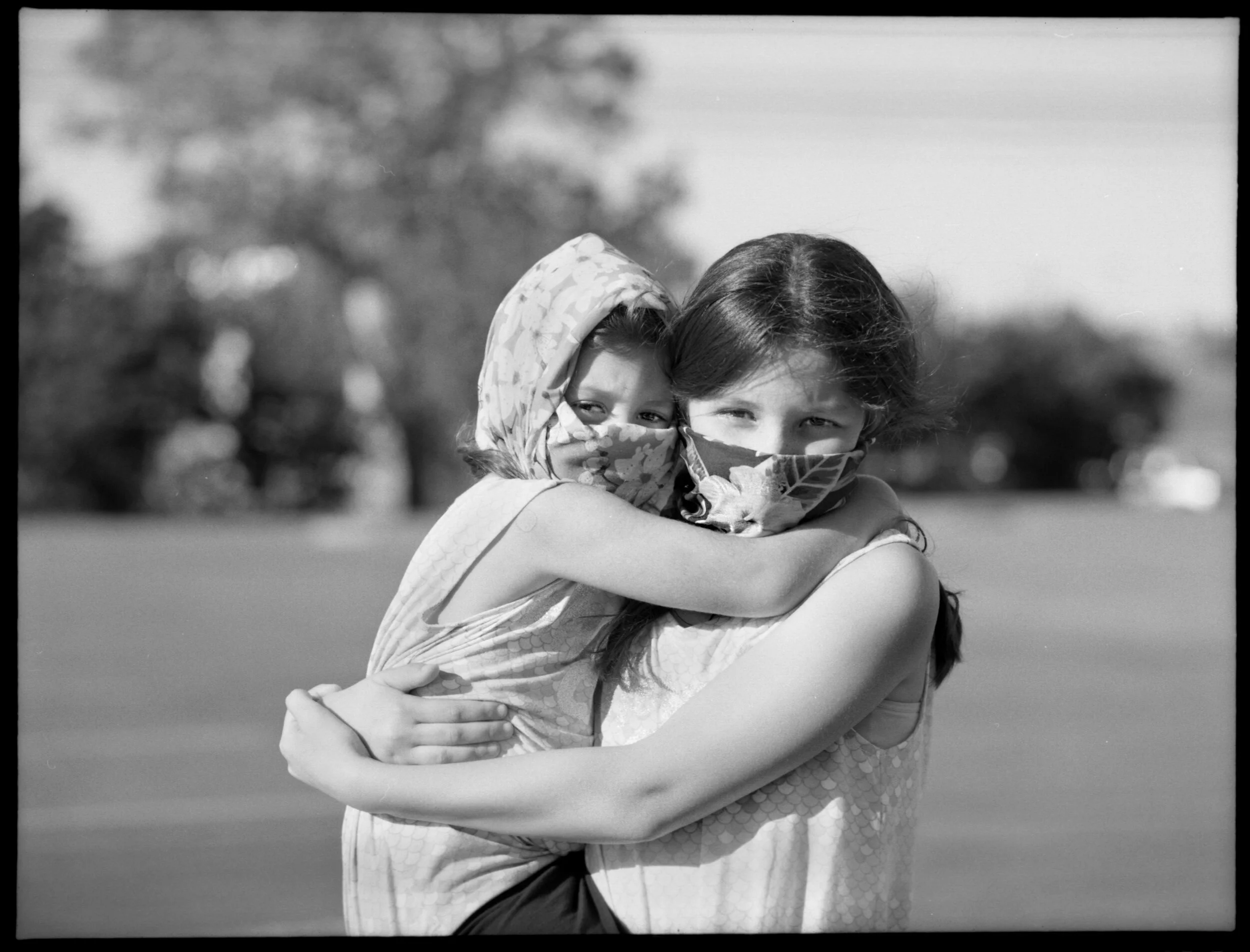  Adrianna Espinoza, 10, right, holds her younger sister Penelope Espinoza, 4, outside of Aldis grocery store in Kileen, Tx on April 19, 2020. Their masks were repurposed from a head scarf their mother bought earlier in the year.  