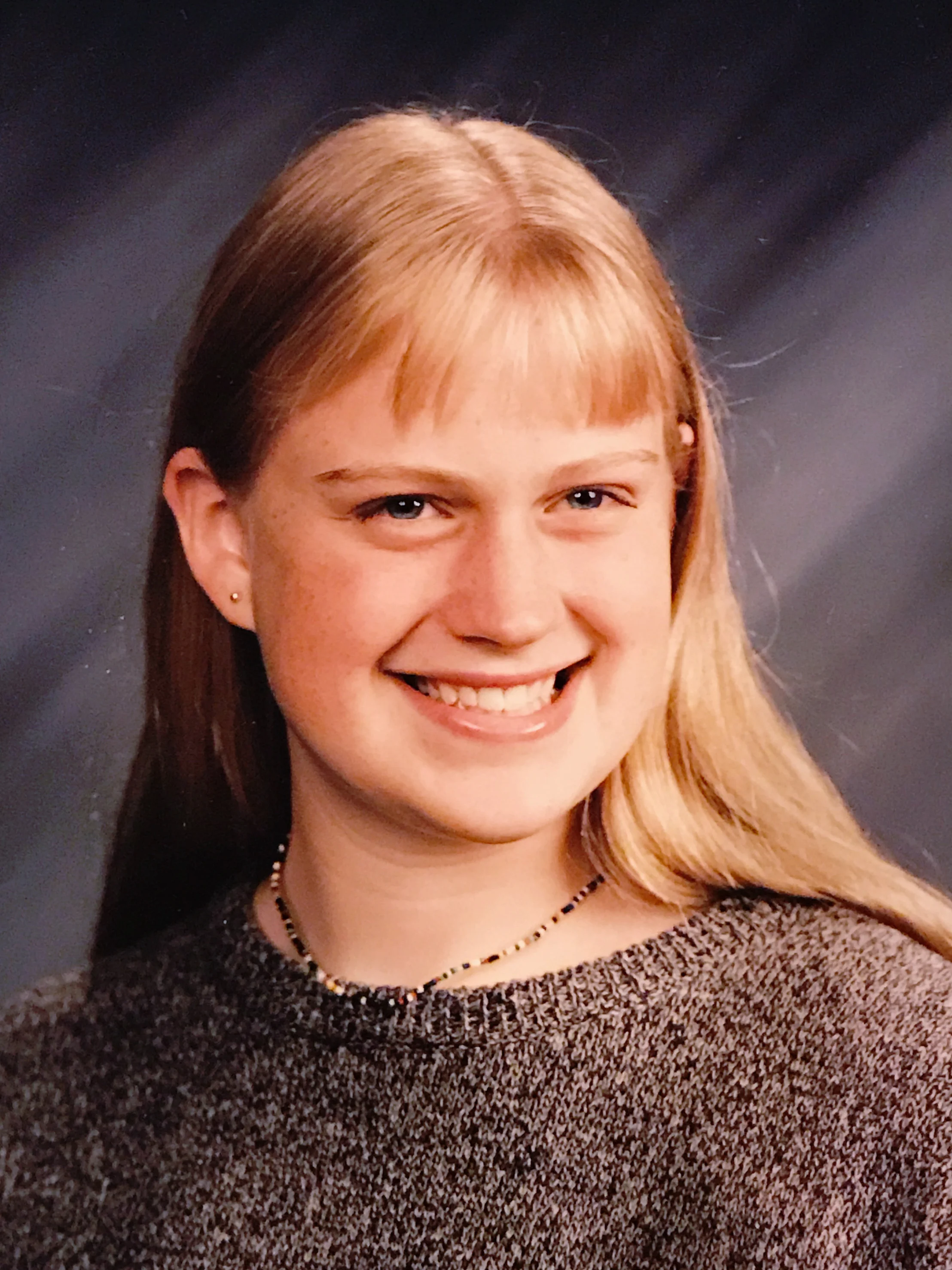 8th grade, wearing an XL sweater to hide my femininity