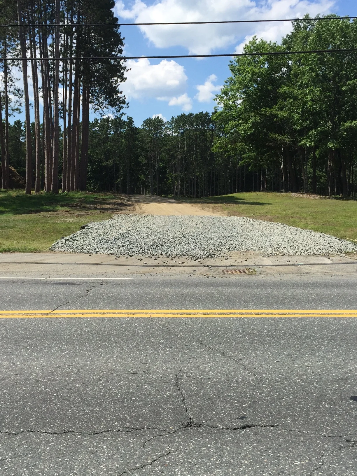 Note that the photo shows large rock on the haul road at the entrance. This is good practice to reduce mud and dirt from truck tires as they enter public streets.