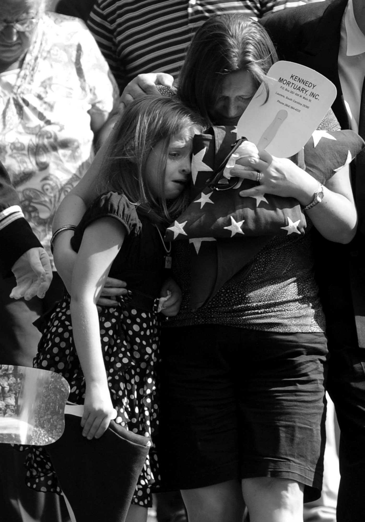 The family of Laurens County Deputy Roger Rice leaves Forest Lawn Cemetery in Laurens after his burial on Sunday. (July 17, 2011) 