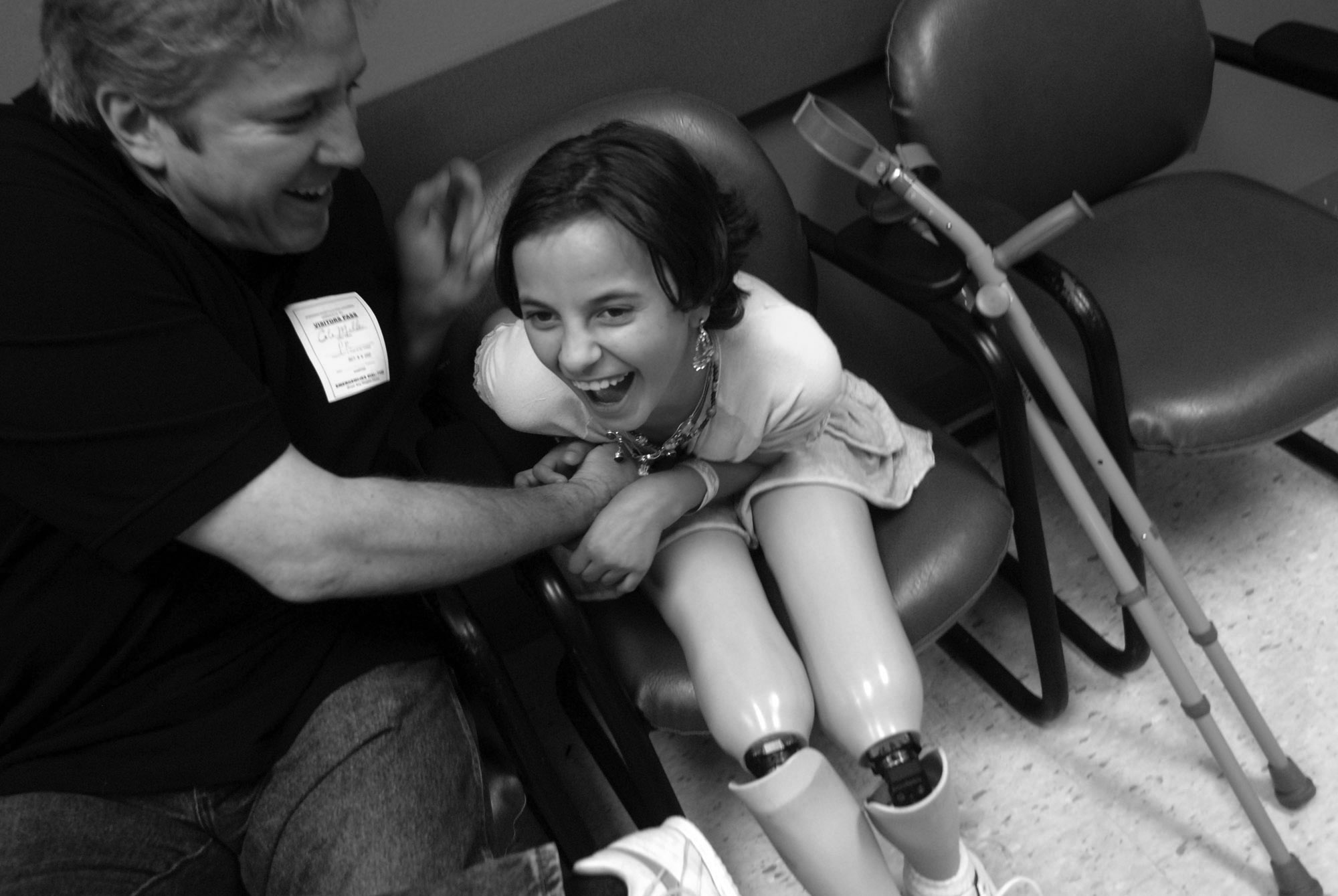  Cole Miller, left, tickles Salee Allawe as they attend her last doctor's visit at Shriners Hospital before she travels home to Iraq.  (October 8, 2007) 