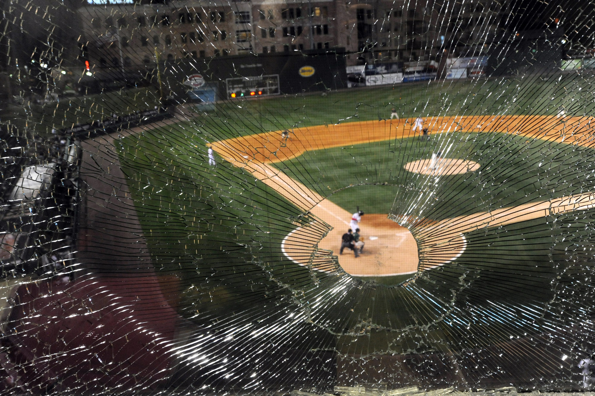  A baseball shatters the press box window as the Greenville Drive hosted the Greensboro Grasshopper at Fluor Field. 