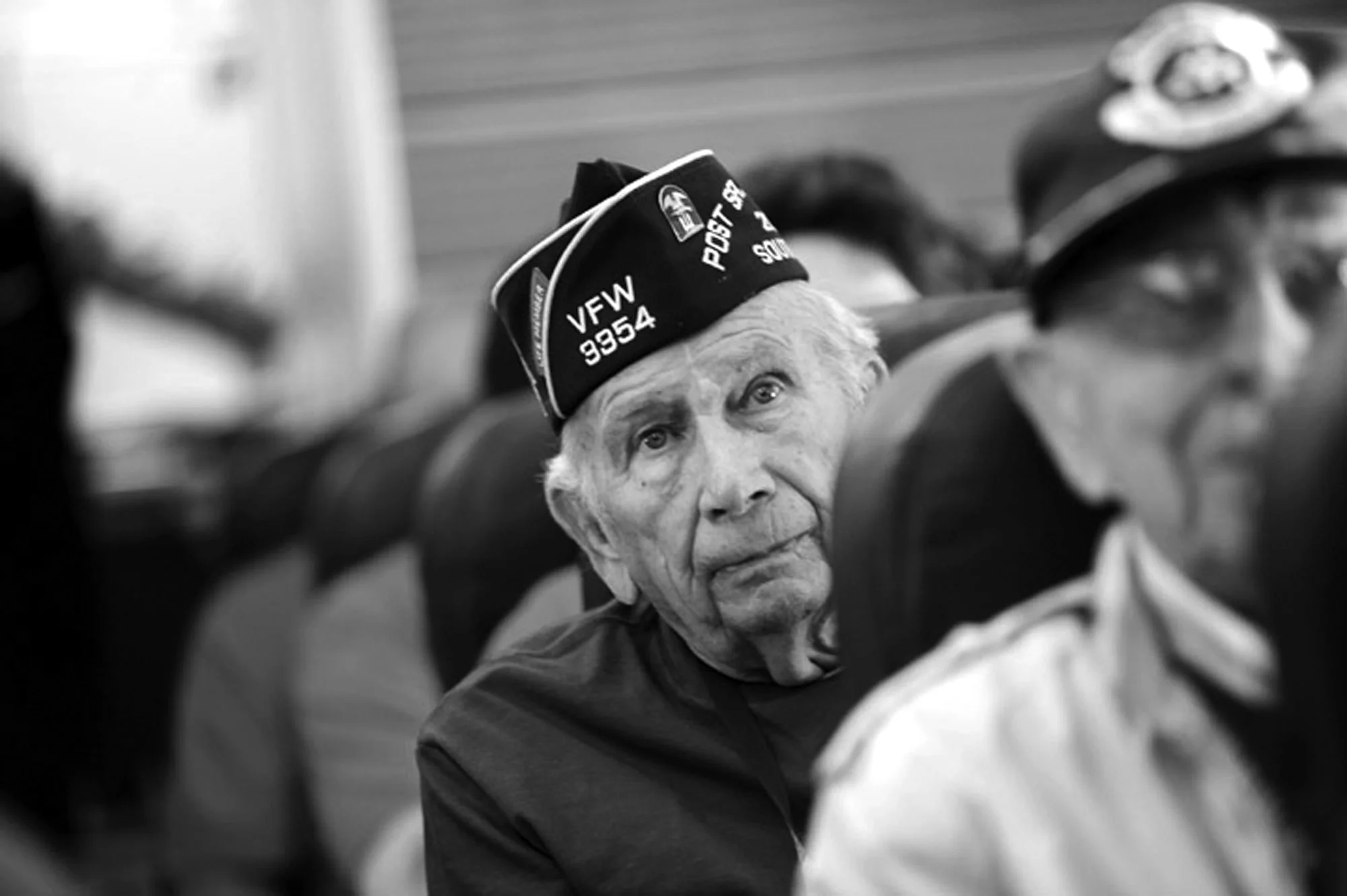World War II veterans traveling from South Carolina to Washington, D.C., sit on a charter plane.