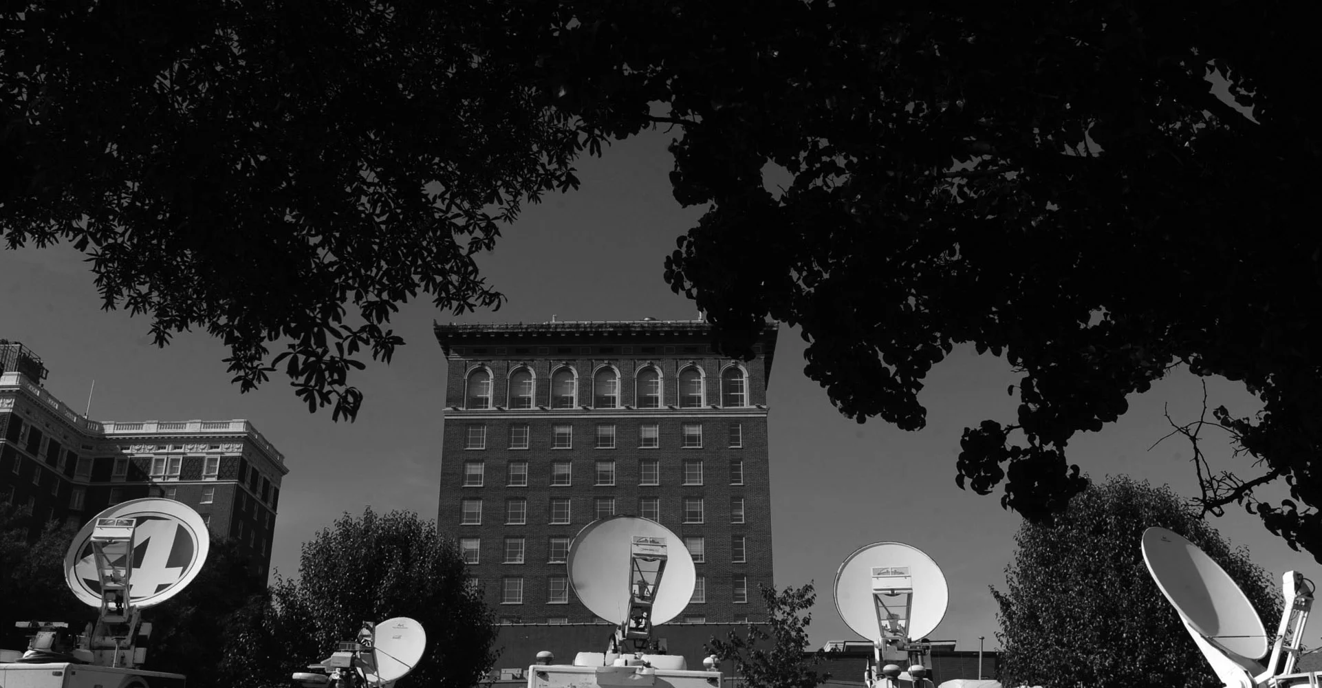 Television satellite trucks line Broad Street in Greenville, as media outlets prepare for the South Carolina republican presidential debate.
