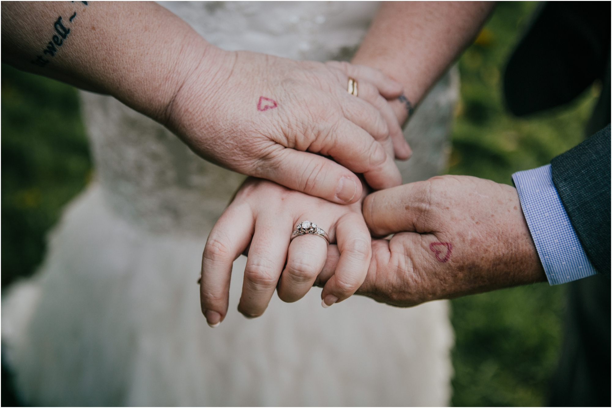  One of my favorite photos from the day! Bethany had drawn a little heart on her parent's hands one day, and they ended up getting it tattooed on!&nbsp; 