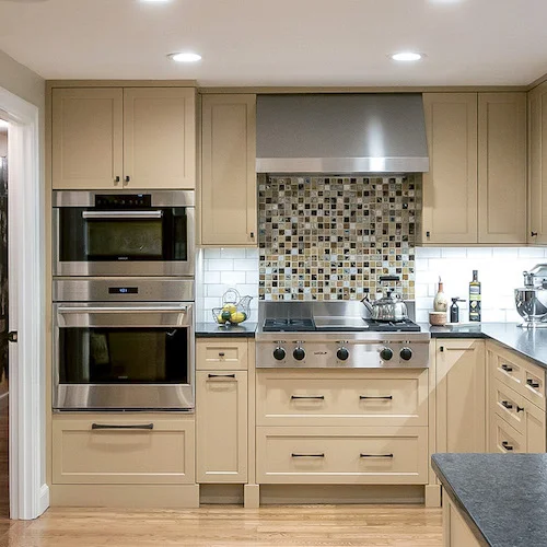 Cooking happens here! The ovens are a steam oven and 30” convection oven and a gas range top by Wolf in a Wayland kitchen.