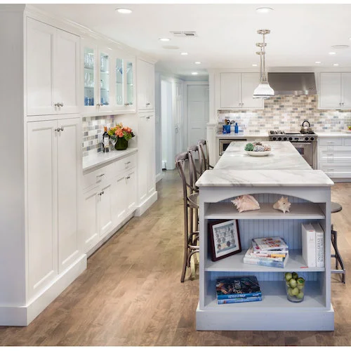 New traditional kitchen with furniture-style, shallow pantry cabinets on either side of a useful buffet.