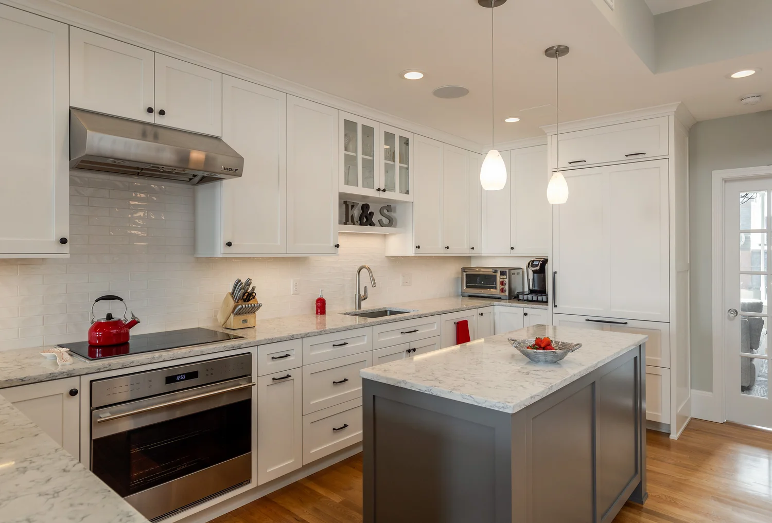 KitchenVisions | Back Bay Brownstone Kitchen with under cabinet lighting and pendant lighting.jpg