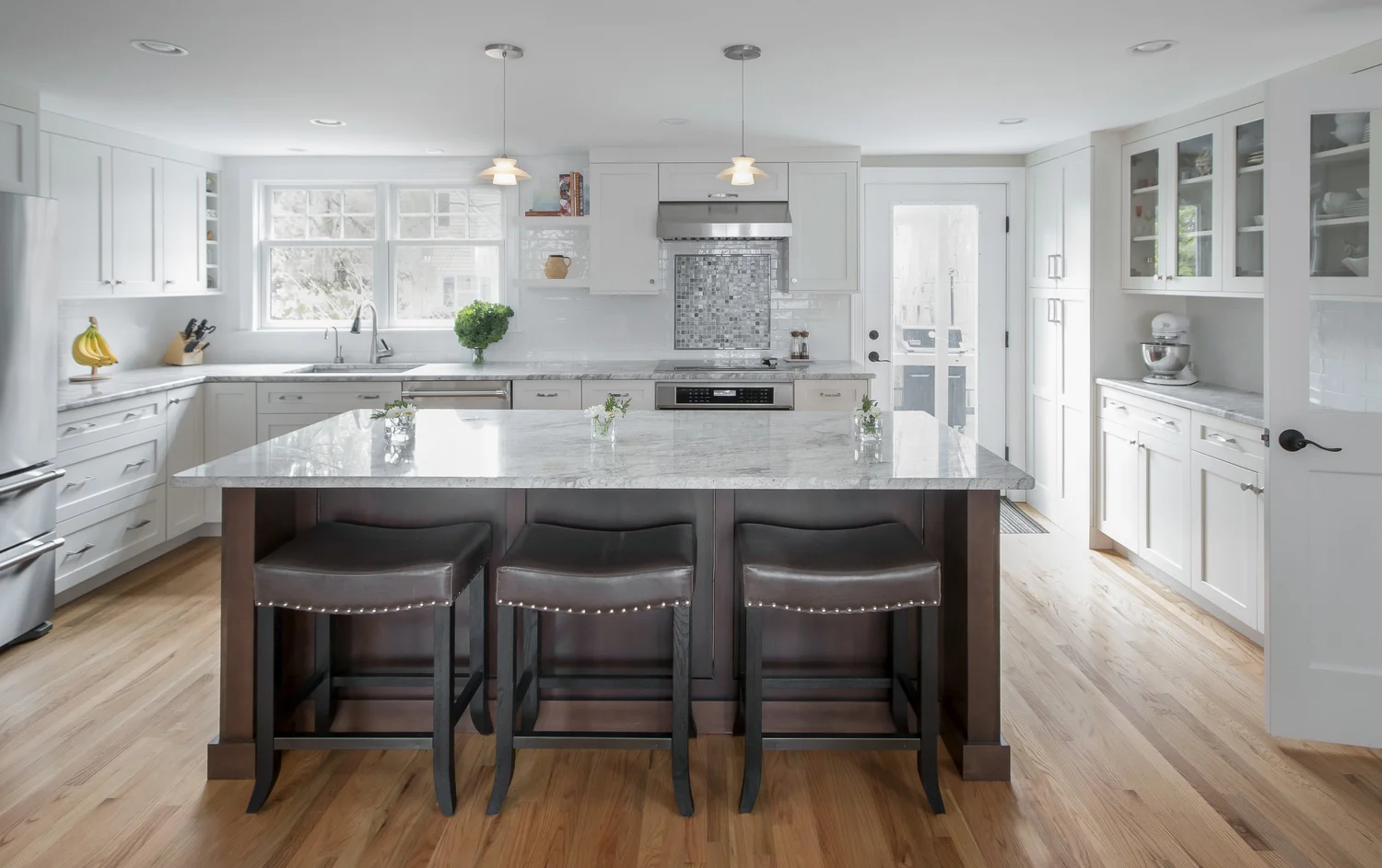Can you guess where the powder room once was in this space? Moving it allowed KitchenVisions to create a large island and great traffic flow.