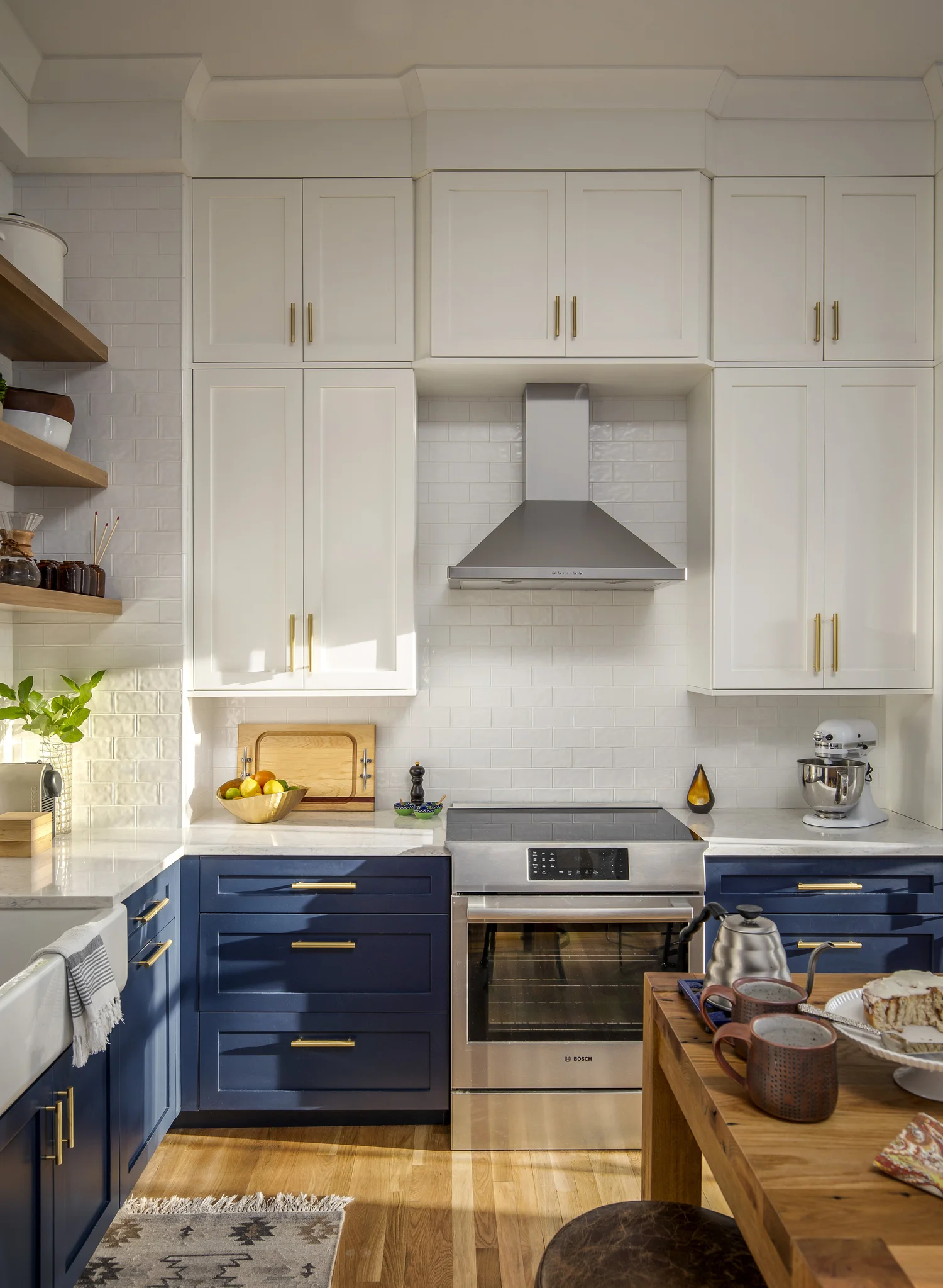 Soaring South End Kitchen with lower cabinets in Sherwin Williams Naval. Photo by Michael Lefebvre.
