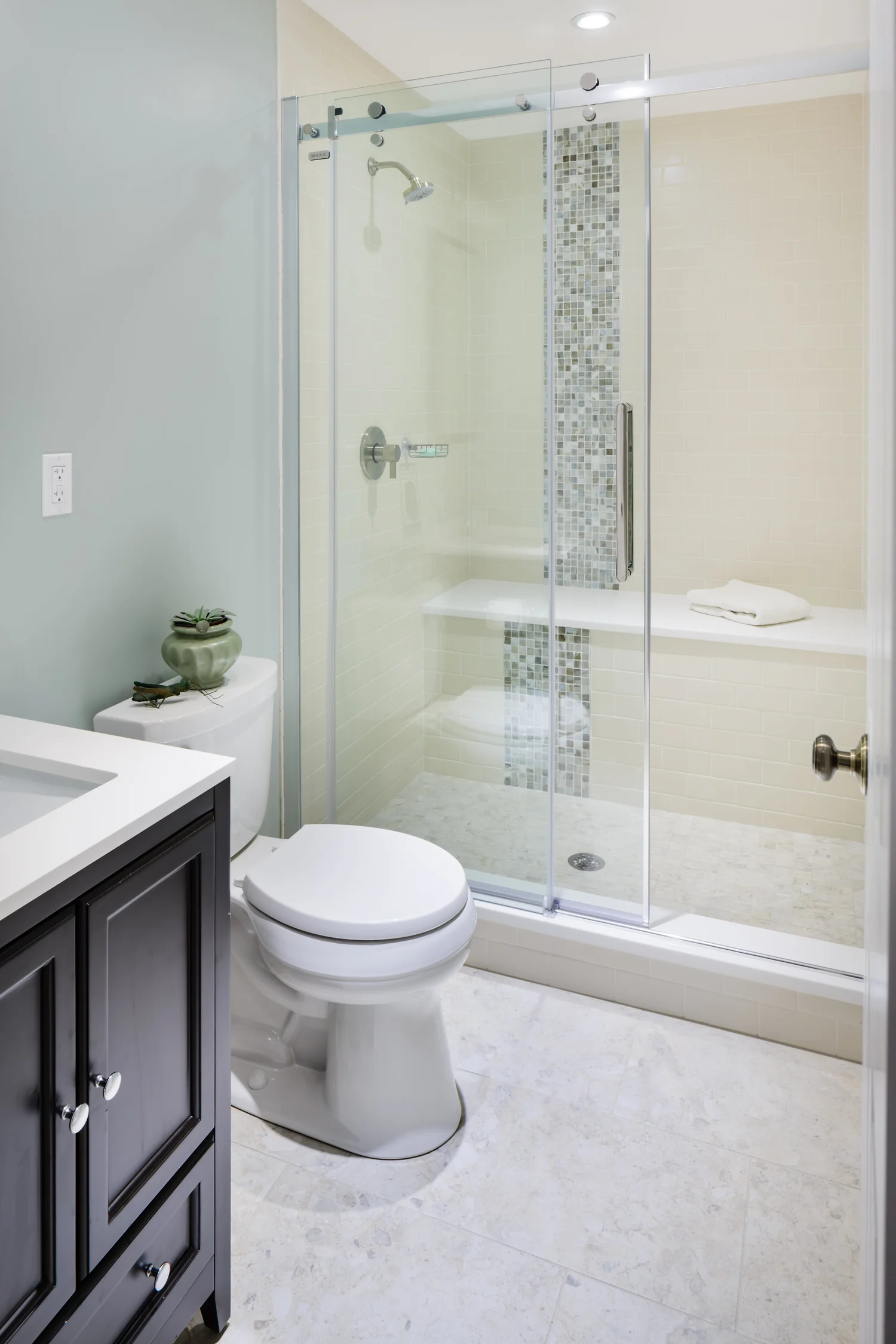 Full bath in our Belmont basement project  Builder: Jensenhus Photographer: Michael Lefebvre