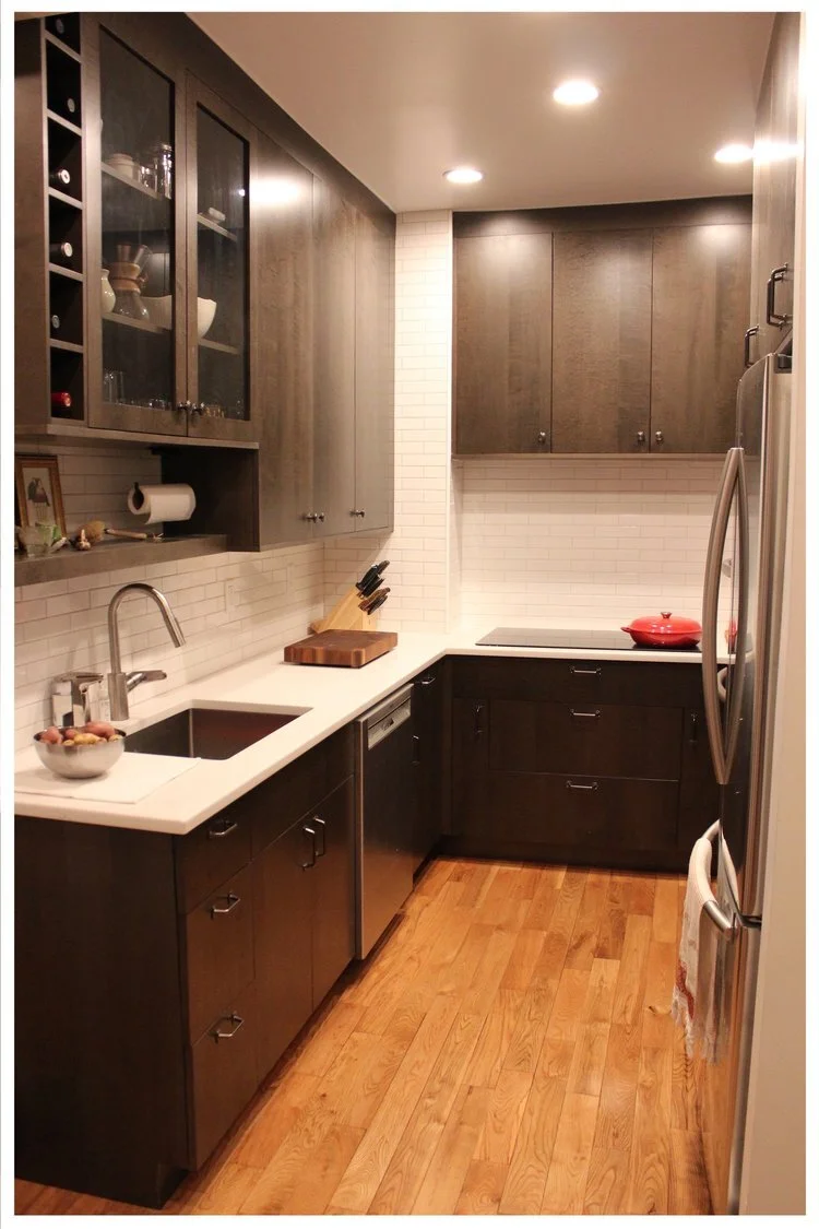 The hardware in this modern kitchen blends in to the cabinetry, keeping the space quiet.