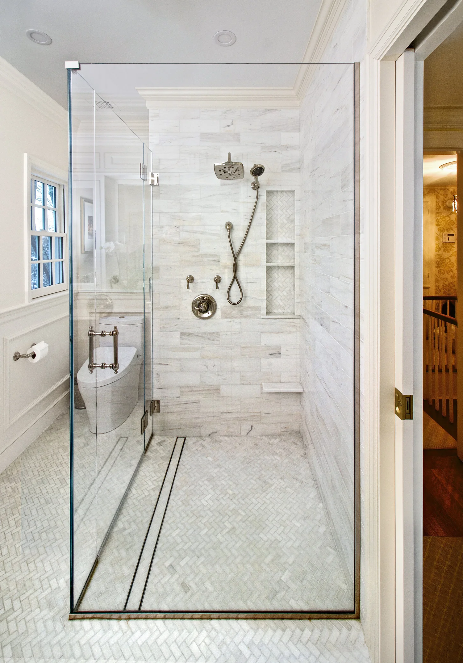 An example of a “curbless” shower which means there is no threshold or barrier for entering the shower. A wheelchair or walker could be used. The toilet has a washlet unit which is also a universal design feature.