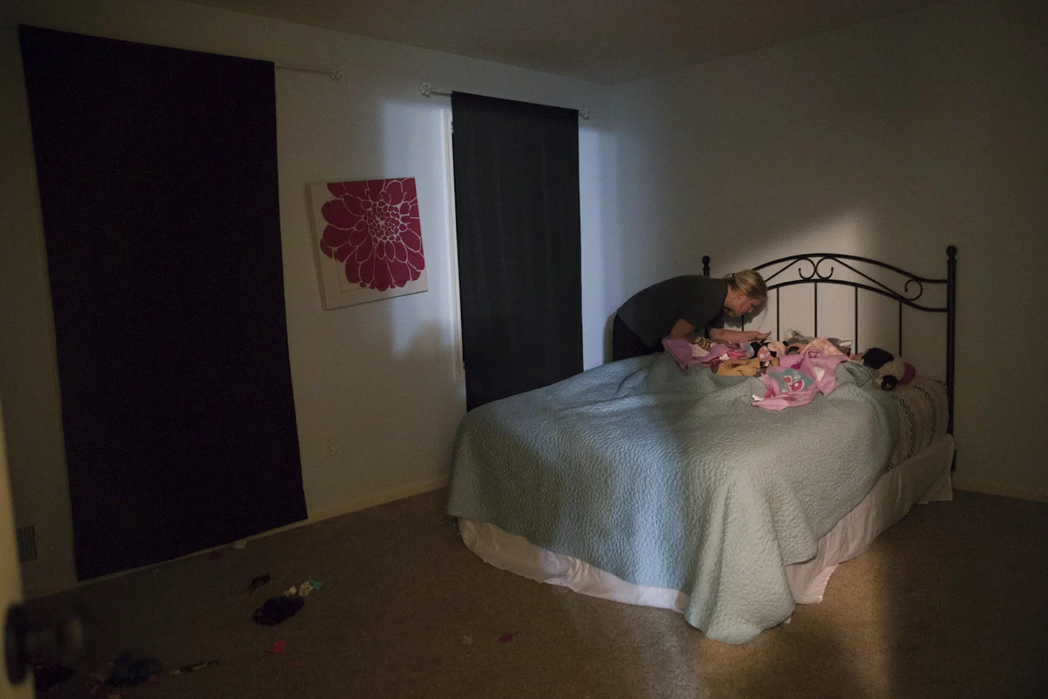 Courtney checks on the girls before she goes to sleep on Oct. 23, 2016 in Lima, New York. Ashlyn and Kylie share a bed together in their room while the boys have two twin size beds in their room.