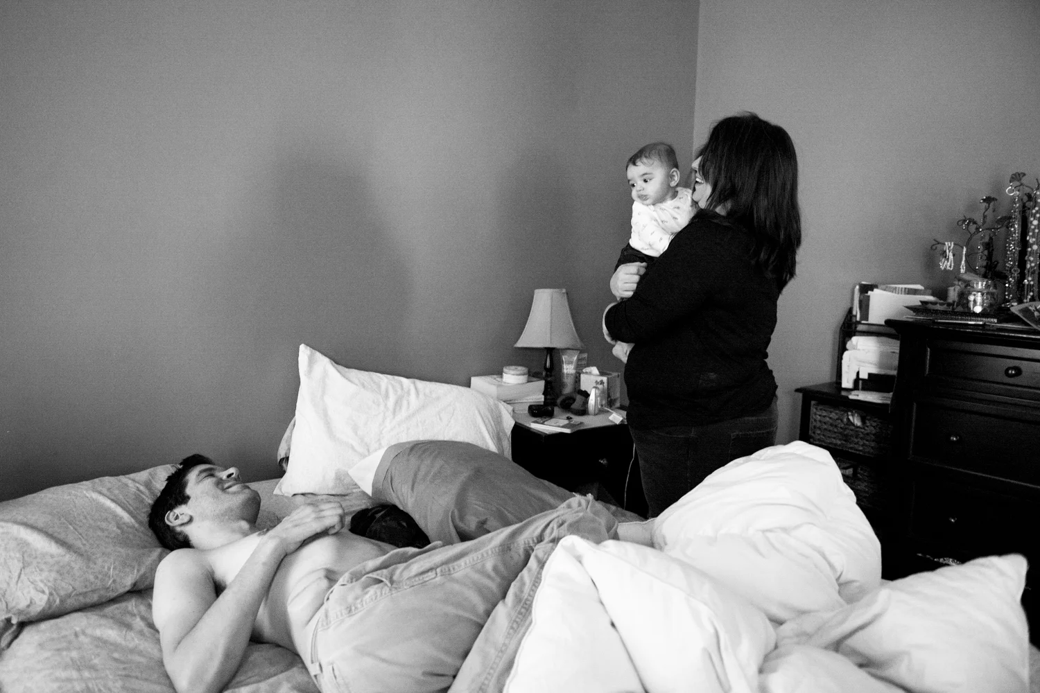 Alissa holds Duncan as David lays down for a nap. He often needs to take naps throughout the day due to the strain he puts on he's body that causes him to tire-out easily. 