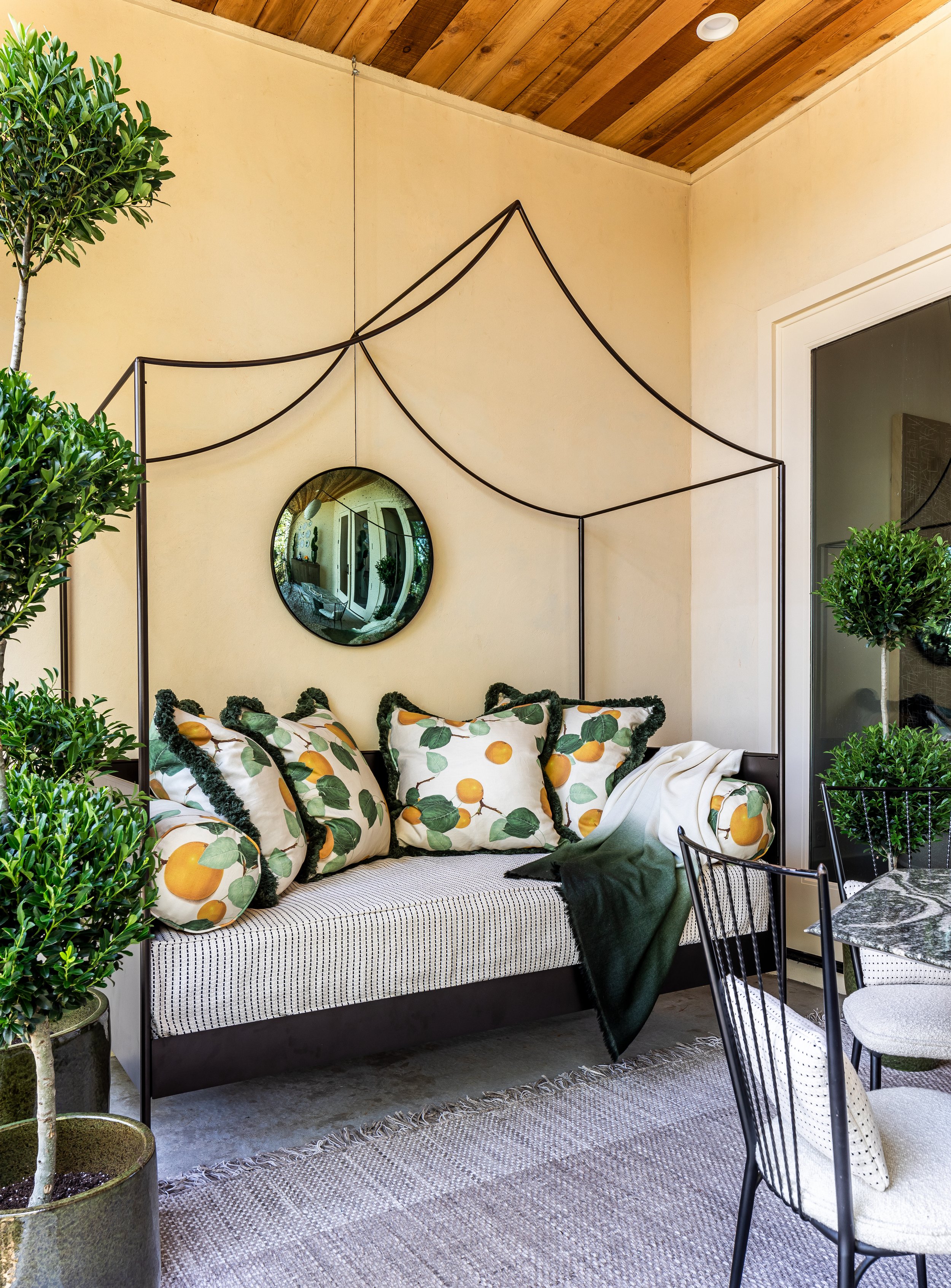Terrace level covered porch daybed | Serenbe Showhouse 2023 | Jeff Herr Photography 