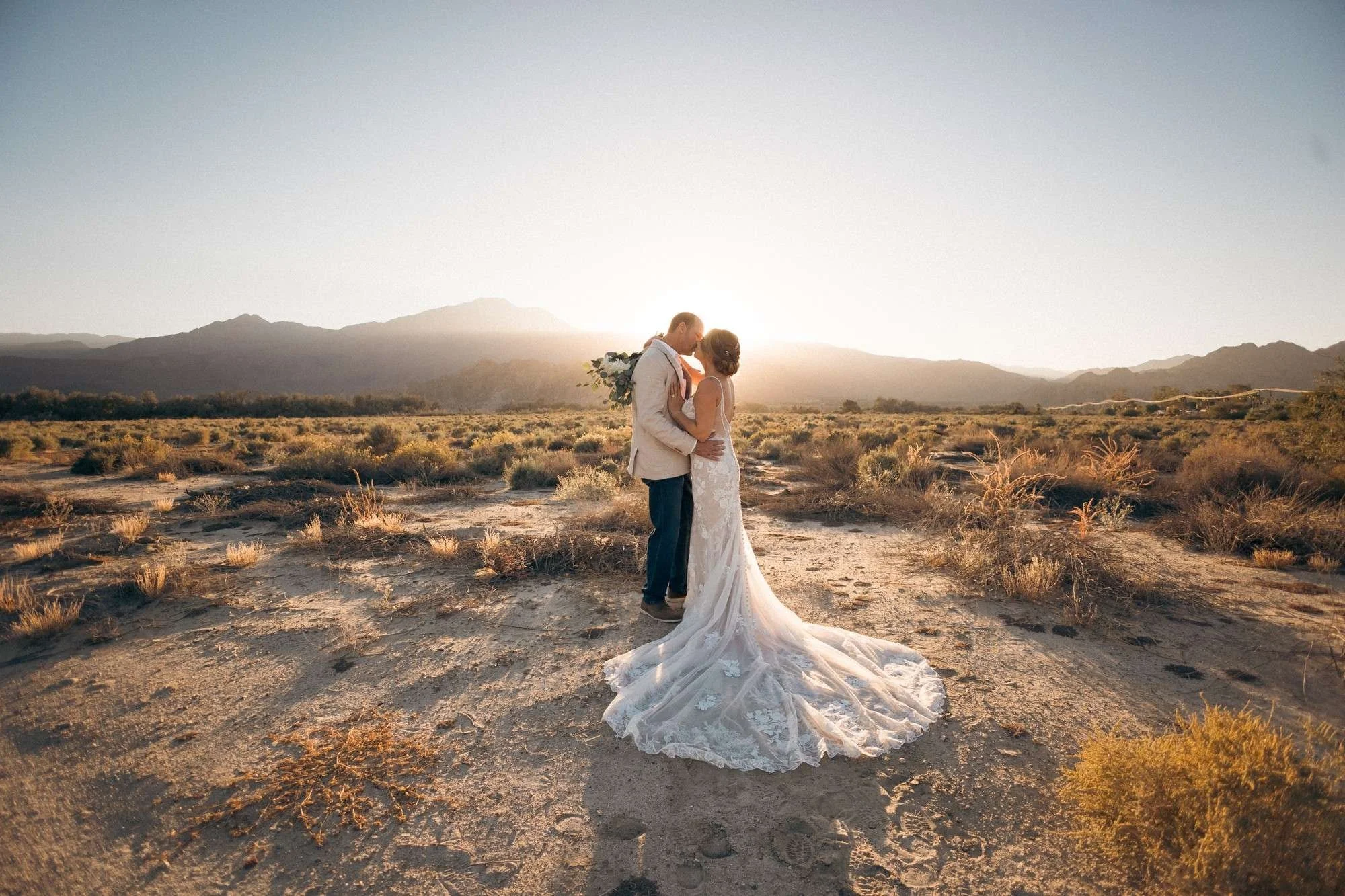 Couple kissing in a desert landscape at sunset in Palm Springs CA (Copy)