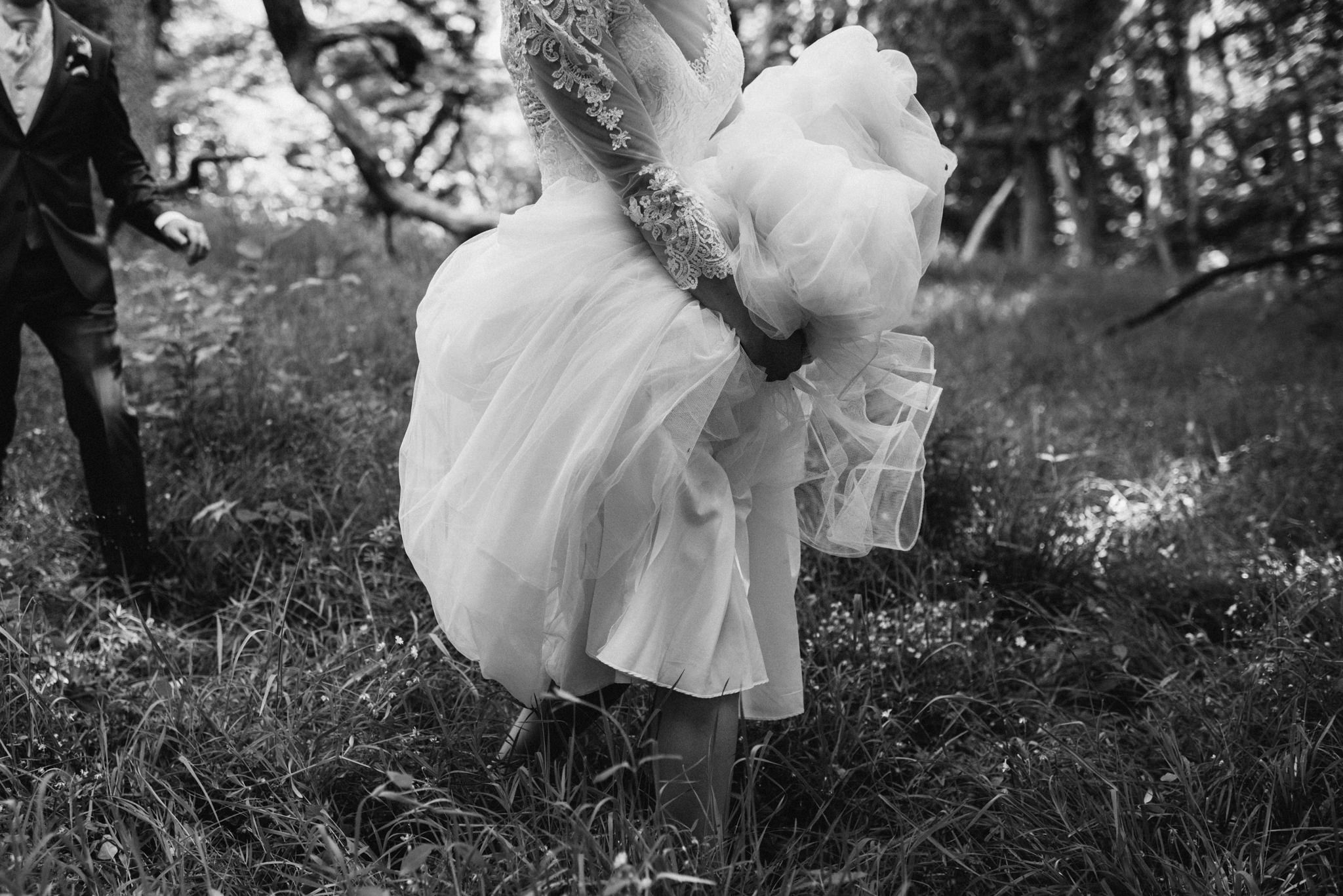 Adventurous bride hiking the forest