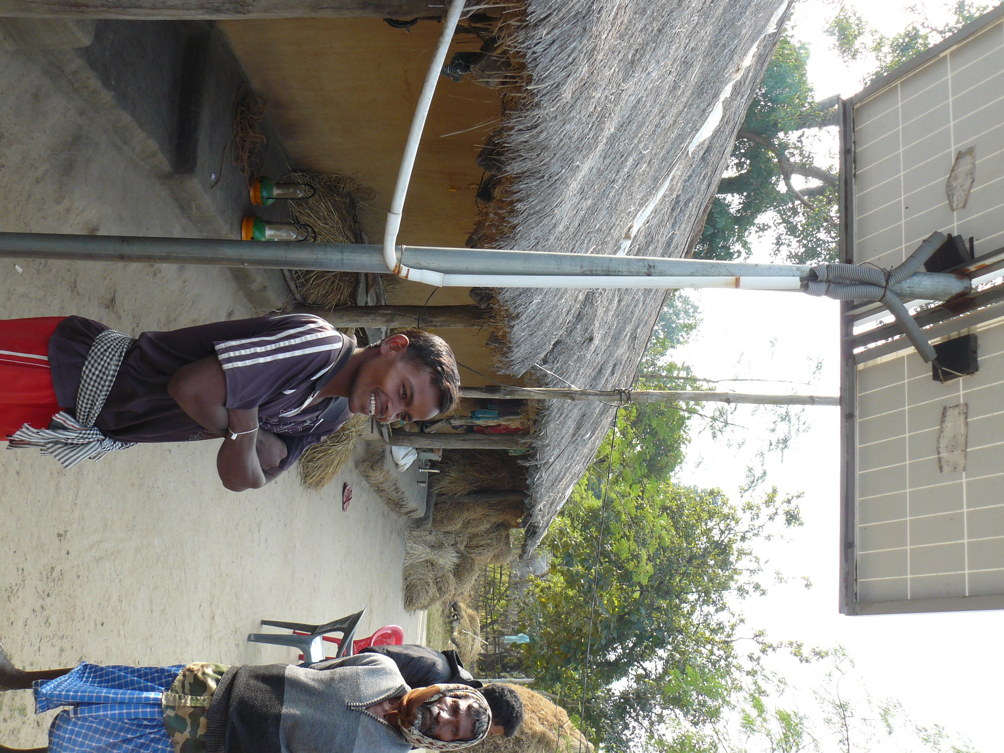 A 'Village Level Entrepreneur' at his solar lantern charging station in Jarak. Villagers pay a daily charging fee and take the lanterns to their homes for the night.